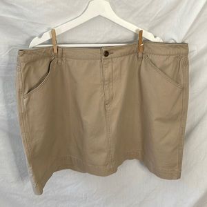 Woman within khaki denim skirt